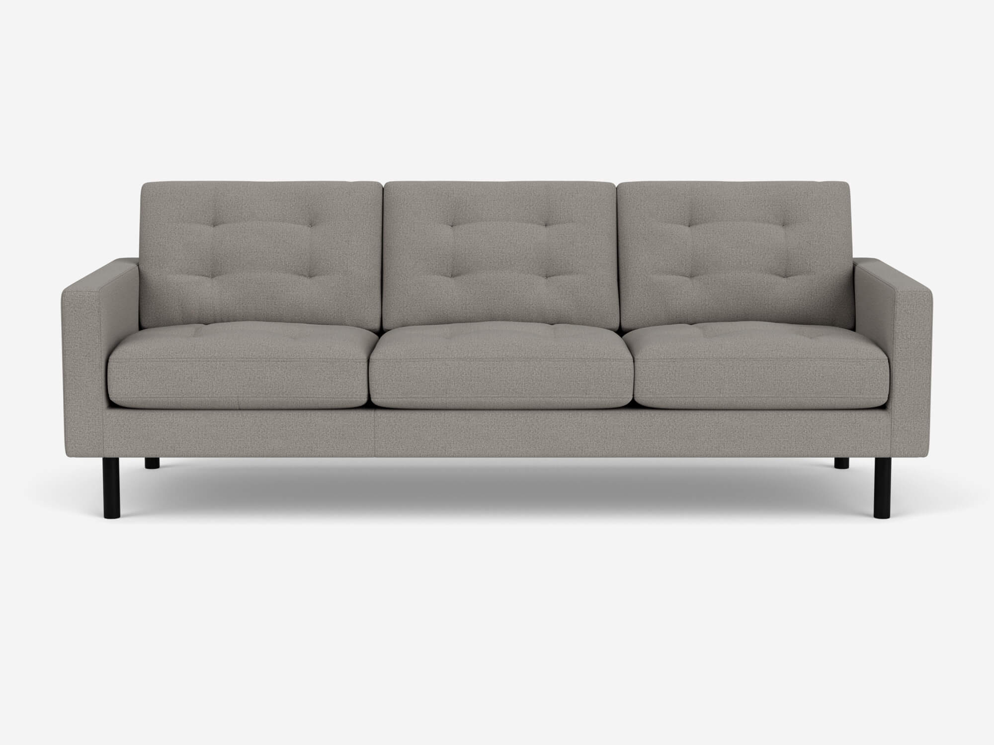 Grey tufted couch front view